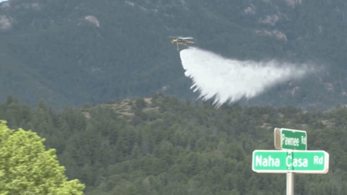 Colorado firefighters get some help from "Goldie" the goat while fighting the Rock Creek Fire.