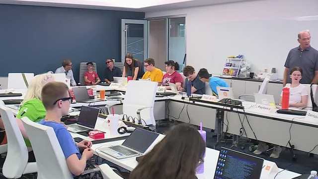 The camp introduces students to Linux and coding using adaptive technology and keyboard commands instead of visual cues. Teachers guide campers through commands while students learn to navigate computers by touch and memory.