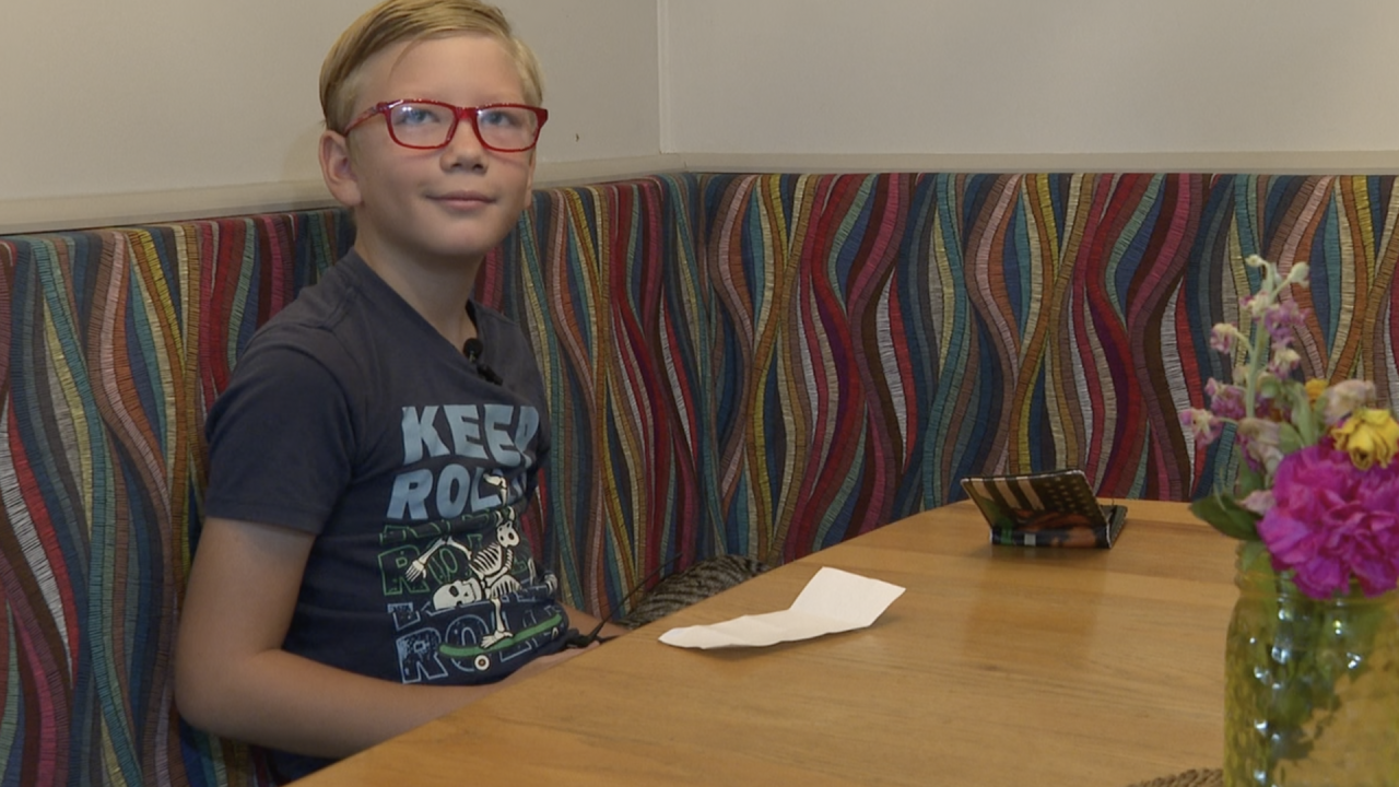 A 9-year-old boy and his grandmother were at a Mesa Bank of America to open his first checking account when a woman attempted to rob the bank at knifepoint. The two hid under a desk as the incident unfolded.