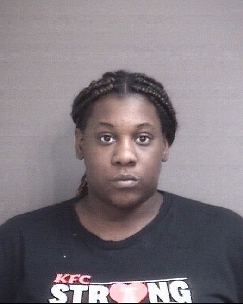 Woman charged after allegedly breaking into residence