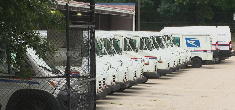 A U.S. Postal Service worker was robbed at gunpoint in the parking lot of a Billerica