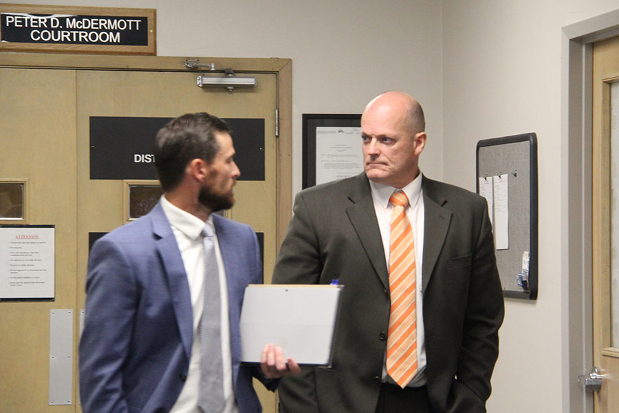 Virgil Larson (right) leaves the courtroom with his attorney