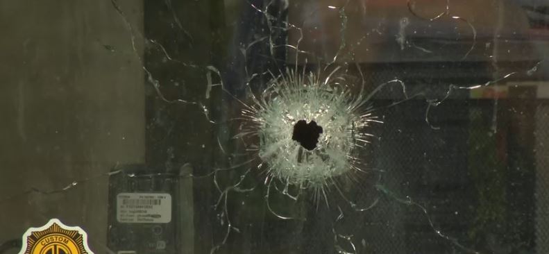 The shooting left shattered glass and bullet holes at the cafe. Three people were taken to a trauma center
