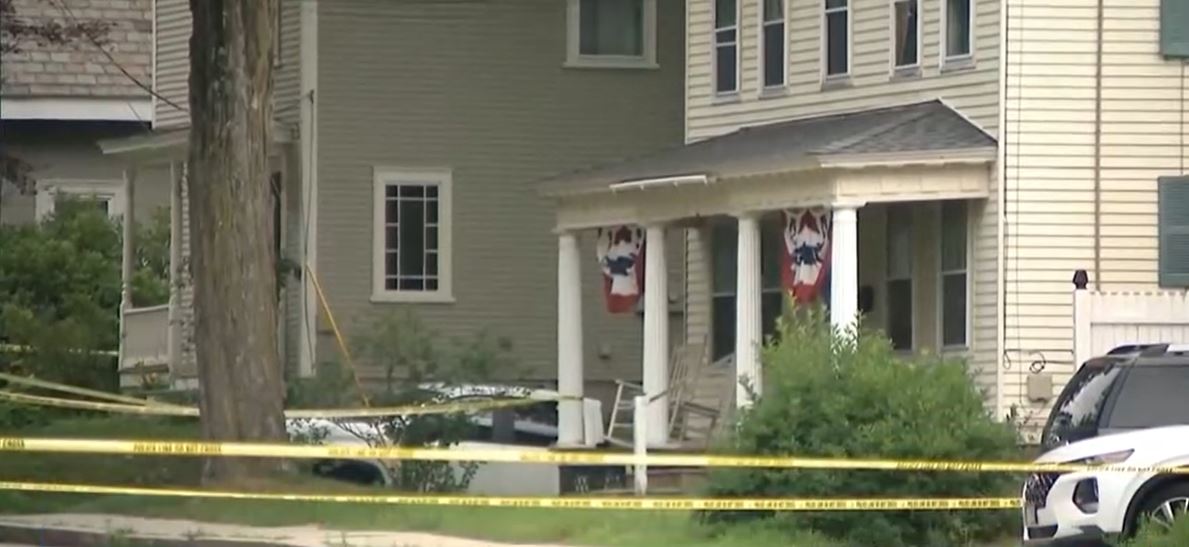 The Attorney General's Office said police who were called to a disturbance at a Grove Street home found a man dead of apparent gunshot wounds. Another man inside the home appeared to have multiple stab wounds and was taken to a hospital for treatment.