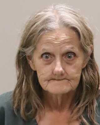 Authorities in Martin County arrested a 77-year-old woman after discovering more than 70 caged cats and an undetermined number of dogs inside her home.