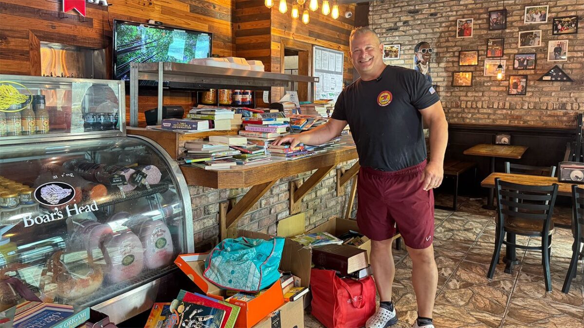Big Apple Pizza owner Scott Van Duzer is expanding the restaurant's free book program by transforming its outdoor patio into a dedicated reading room where children can pick up a book any time they visit.
