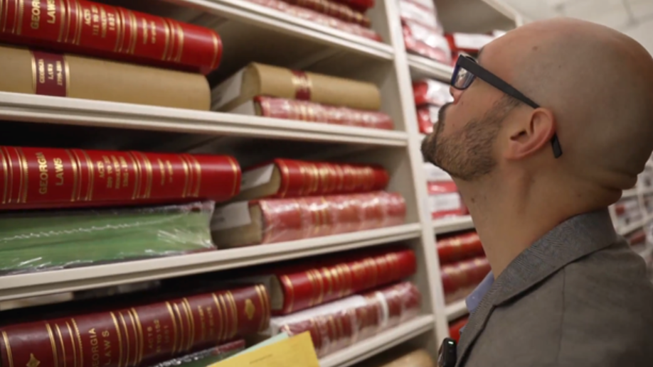 Collections manager Hendry Miller helps protect some key documents of Georgia history.