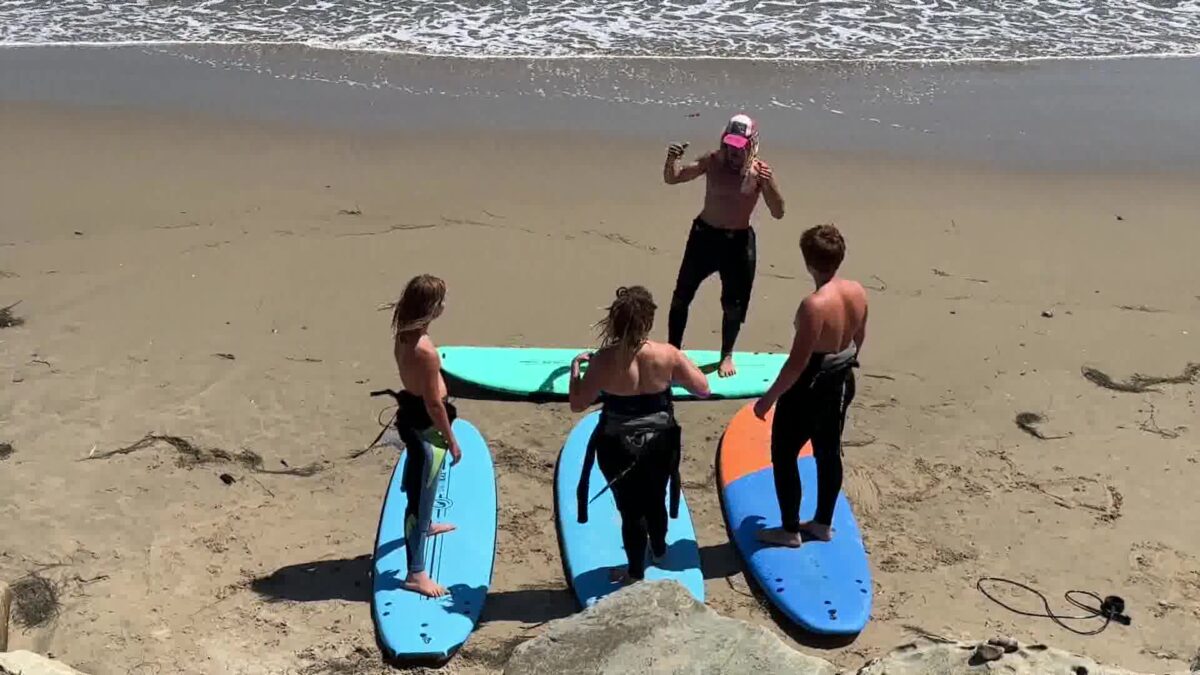 Newbie Surfers Beat the Heat at the Beach