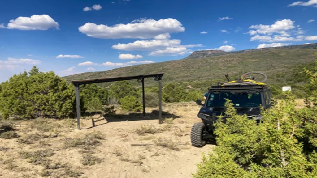 Rescue personnel met and treated a dehydrated mountain biker at this memorial shelter on Aug. 3. The shelter was erected nine months ago by the family of a man who died on the trail of heat exposure in 2022.