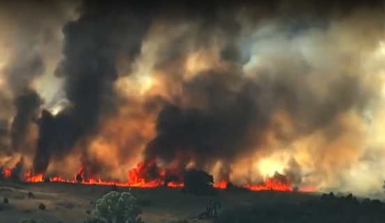 A wildfire near Gracemont burned hundreds of acres and threatened nearby structures as crews battled flames across the state.
