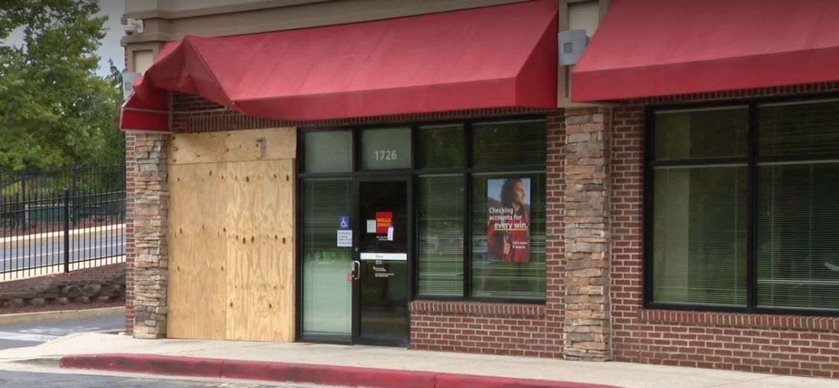 Thieves use an excavator and other construction equipment to steal an ATM from a Wells Fargo branch.