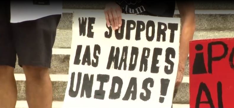 A group of migrant mothers rallied downtown Tuesday