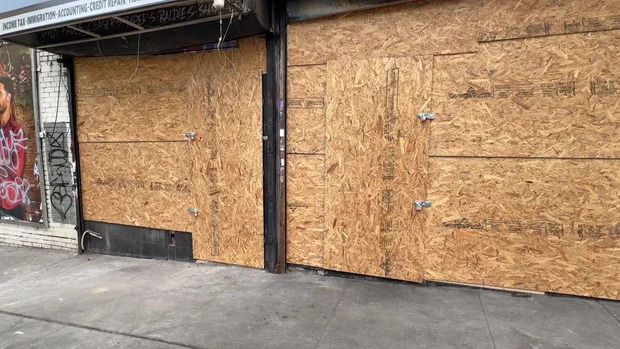 Police say a fire damaged a row of Bronx businesses on Aug. 11