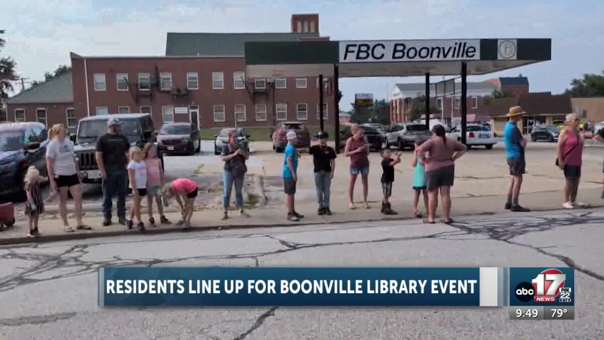 Residents celebrate Boonville library’s new location with bookworm relay