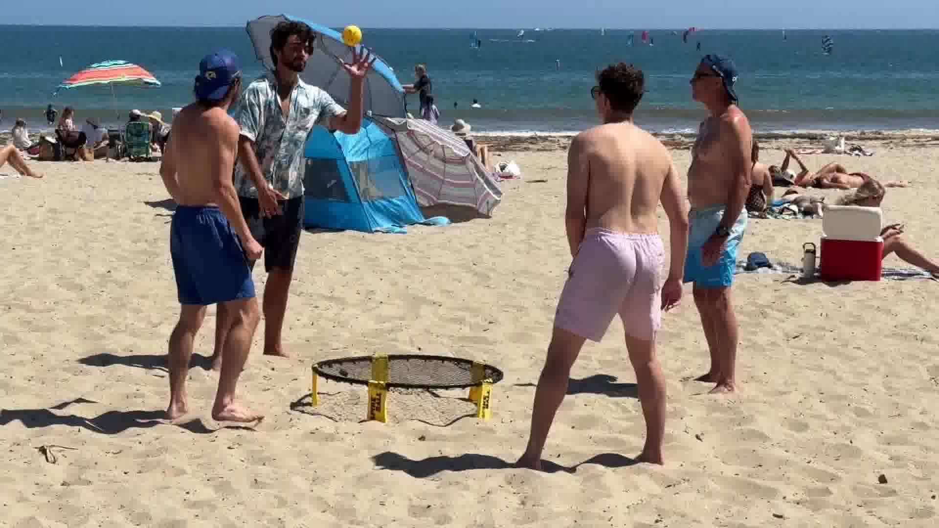 Beachgoers beat the heat along the shore