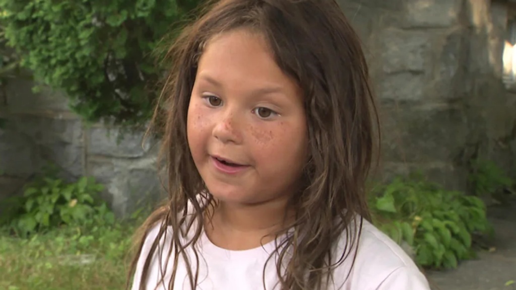 Janessa says she was on her friend's bike in the backyard when the animal lunged at her