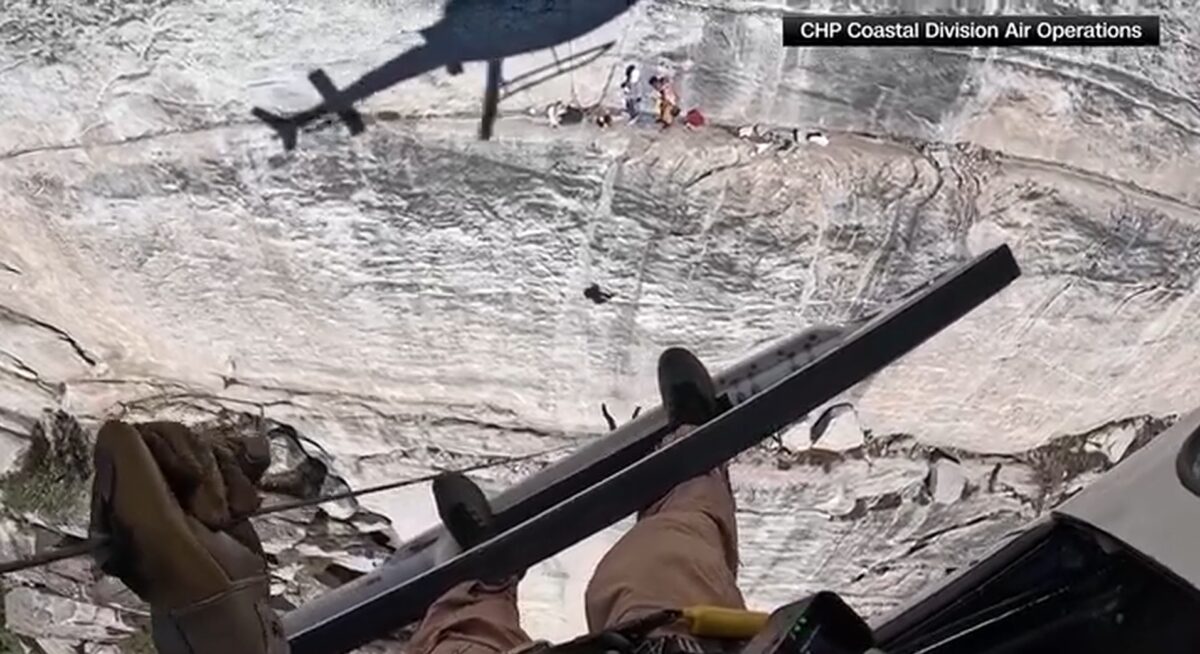 Rescuers in California use a helicopter to lift an injured man off a 700-foot cliff where he had become trapped.
