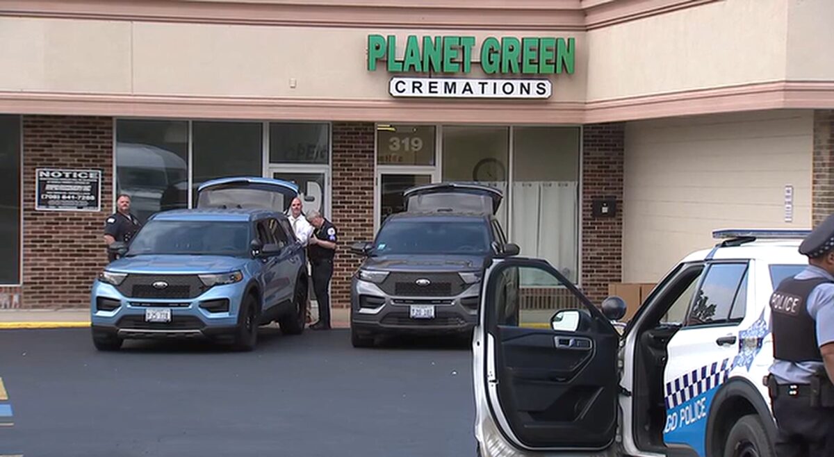 Officers carried dozens of boxes out of Planet Green Cremations in Glenwood and loaded them into unmarked Chicago police vehicles.