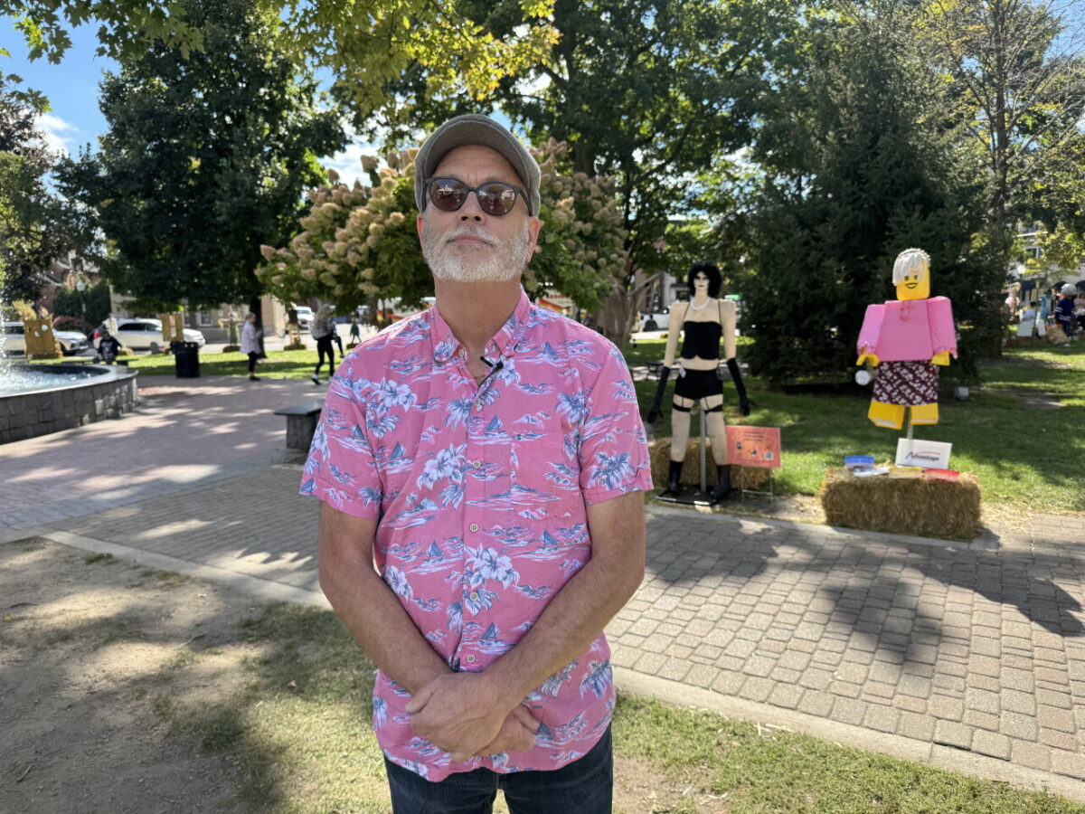 A scarecrow depicting Frank-N-Furter from "The Rocky Horror Picture Show" will remain on display in downtown Plymouth after the organization behind it decided against covering it up following complaints.