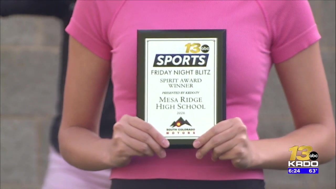Mesa Ridge High School receives the South Colorado Motors Friday Night Blitz Spirit Award plaque