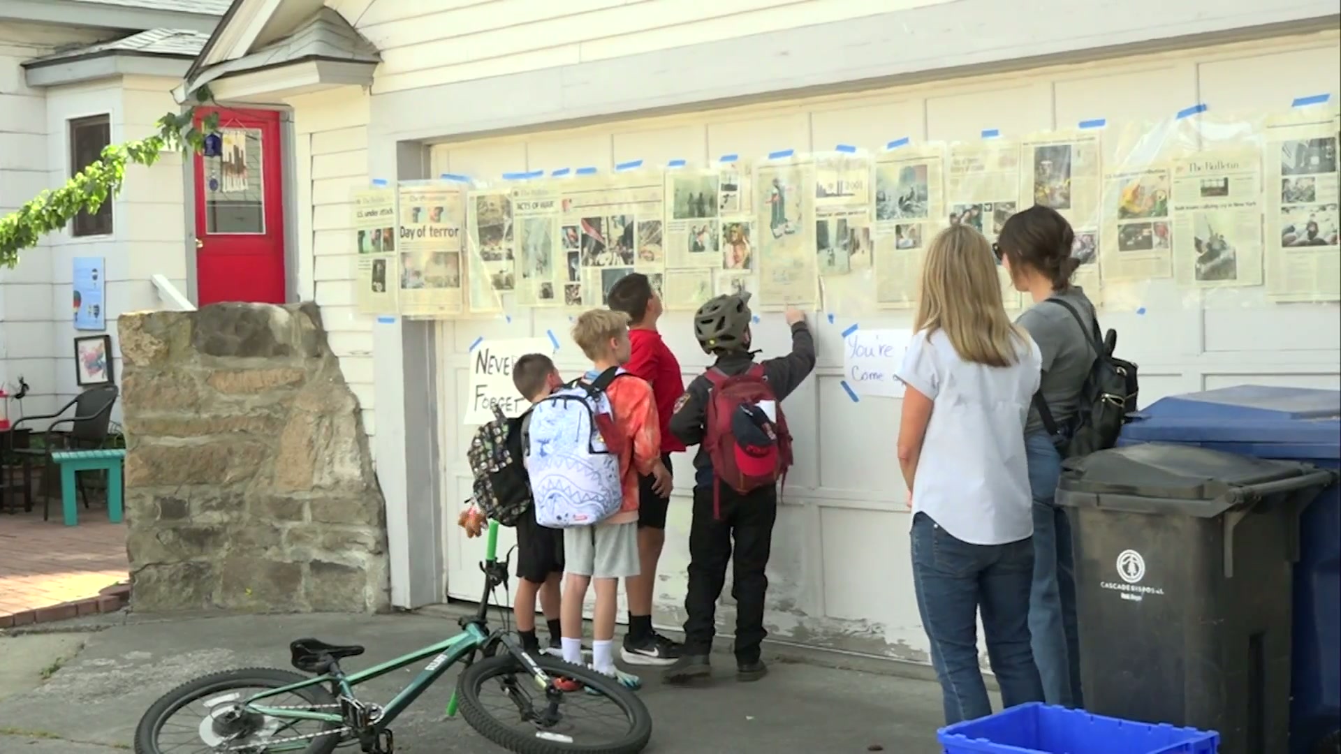 Historic 9/11 Newspaper Exhibit Displayed on Bend Garage