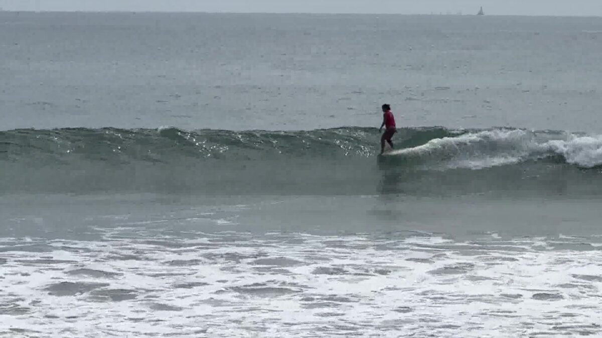 Surfers Hang Ten at Queen of the Point