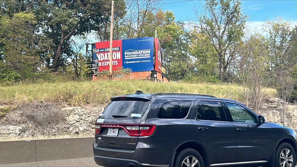 Fire at encampment burns billboard along Highway 50 in Jefferson City
