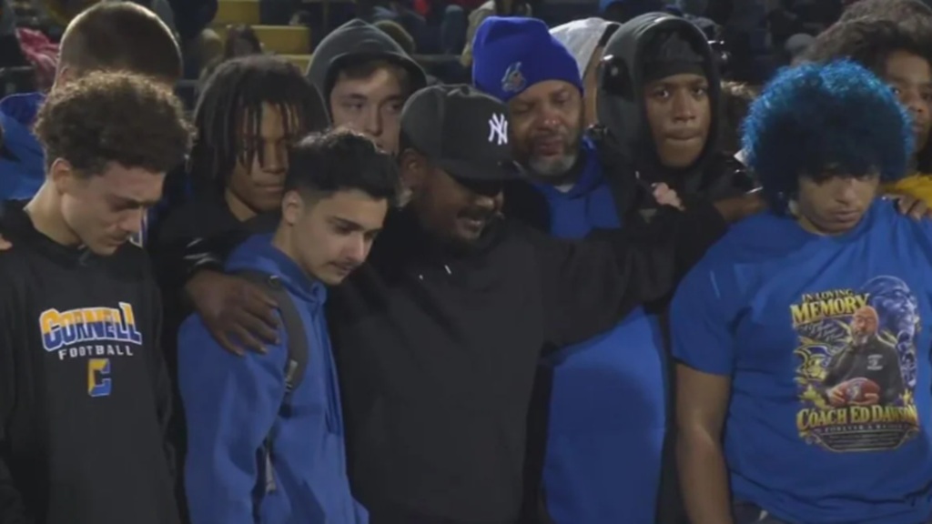 The Cornell school community came together Sunday night in an emotional candlelight vigil held in Coraopolis for head football coach Ed Dawson