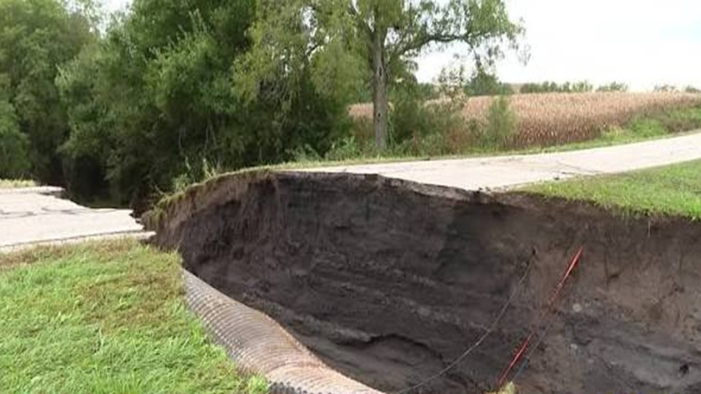 KETV observed a huge gap in the collapsed road over the creek on Road F-58