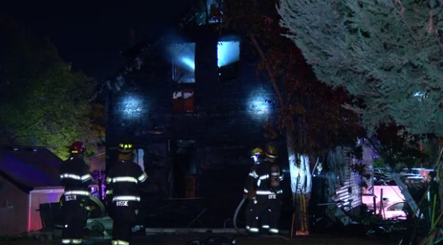 A Minnesota State Patrol trooper ran into a burning Minneapolis home overnight October 8 to rescue residents