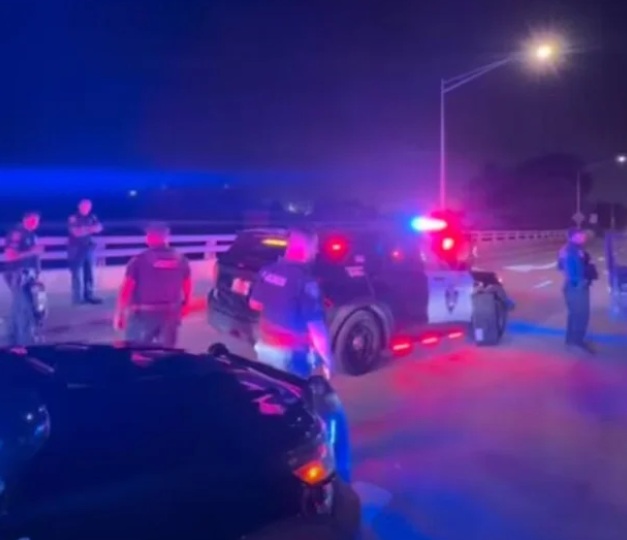 South San Francisco police officers at a standoff with a woman in her vehicle on the Sneath Avenue overpass above Interstate Highway 280